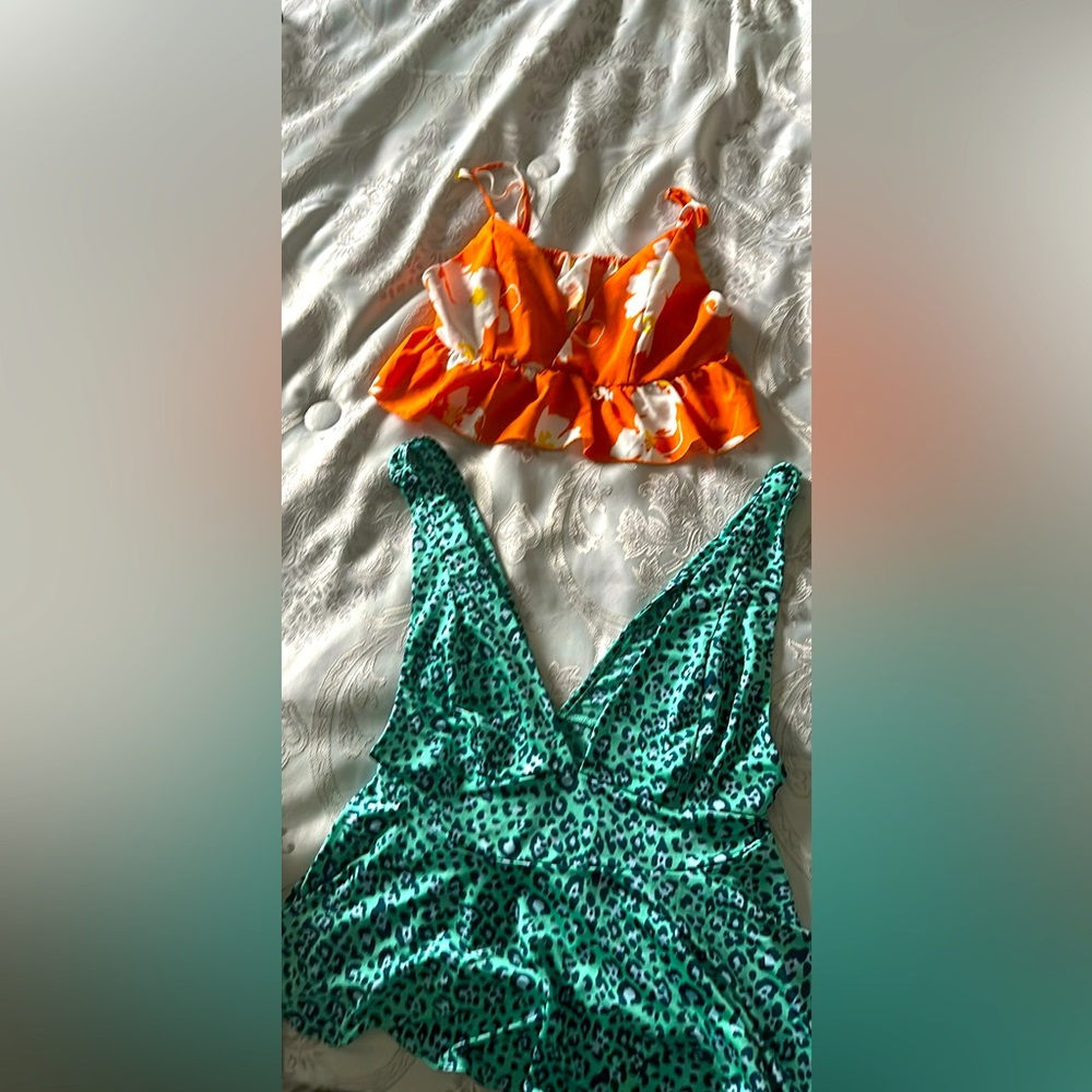2 gorgeous peplum tops size small and medium